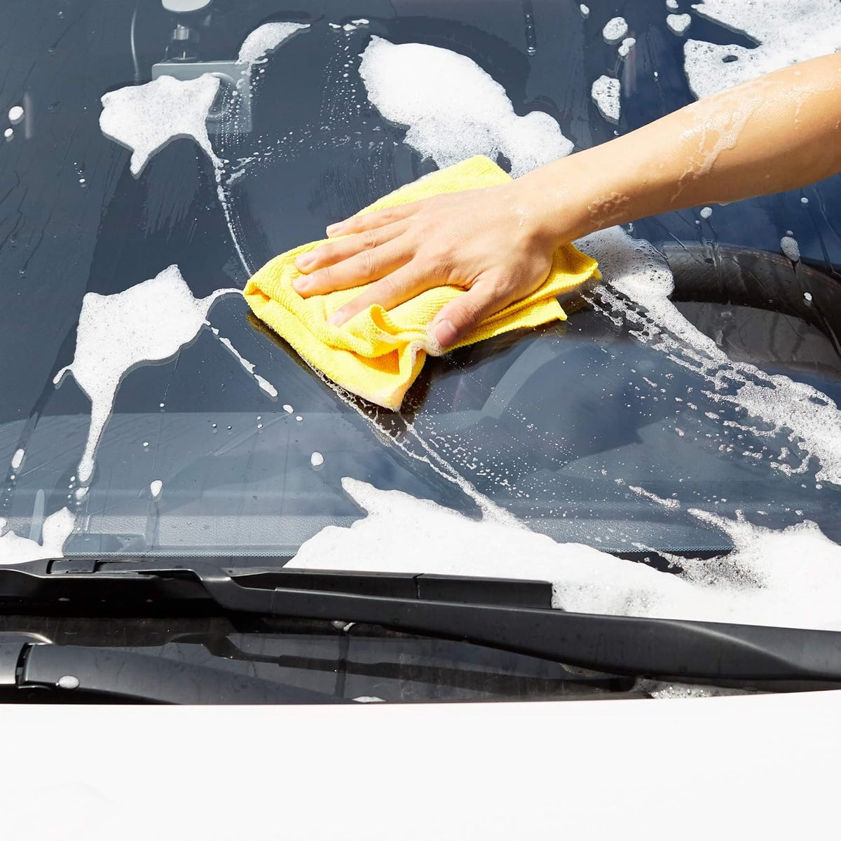 Yellow microfiber cloth used to wash and wipe a vehicle windshield