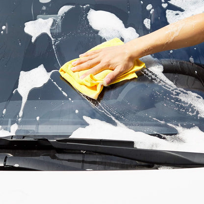 Yellow microfiber cloth used to wash and wipe a vehicle windshield